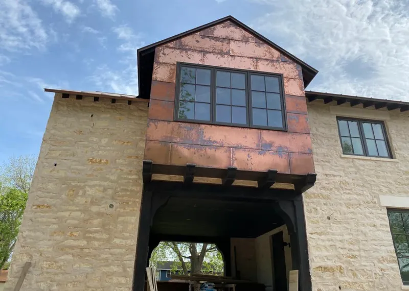 Copper metal panel facade on a stone building for Skylight Installation in Christiansburg